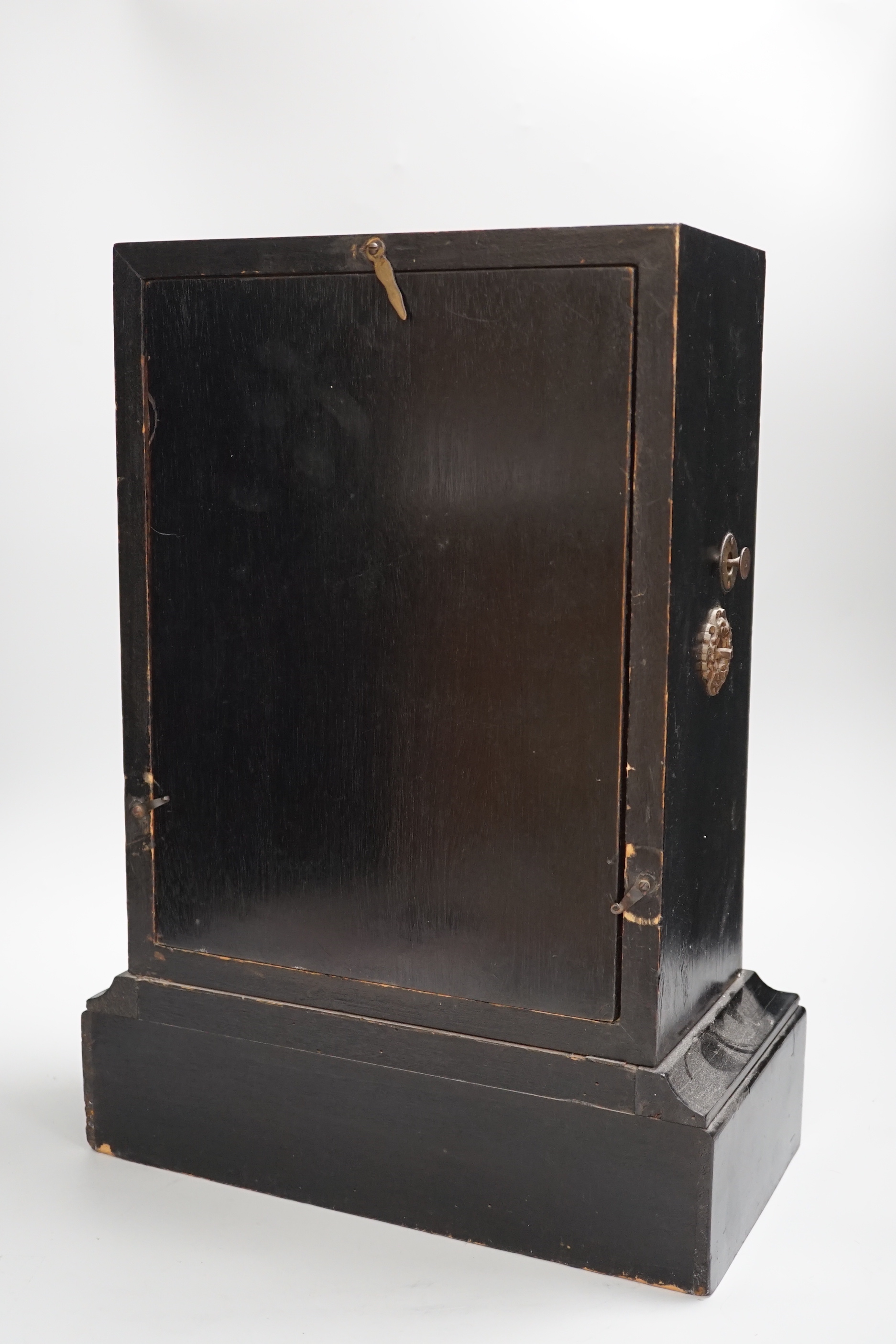 A 19th century ebonised mantel clock combined perpetual calendar, 44cm tall